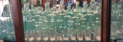 A Sea Of Aqua Medicine Bottles