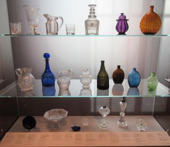 Display Case of Antique Bottles and Glass